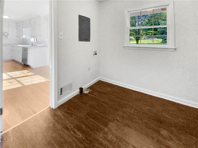 laundry area featuring hardwood / wood-style flooring, sink, and hookup for a washing machine