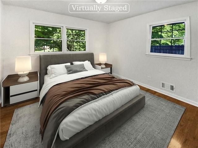 bedroom featuring dark hardwood / wood-style flooring