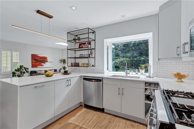 935 Cumberland Rd NE, Atlanta, GA 30306 - kitchen with stainless steel appliances, healthy amount of natural light, light countertops, and a peninsula