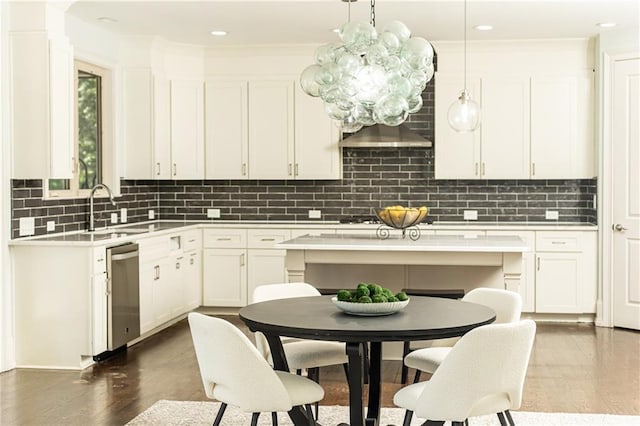 kitchen with decorative light fixtures, dishwasher, white cabinetry, and dark wood-type flooring