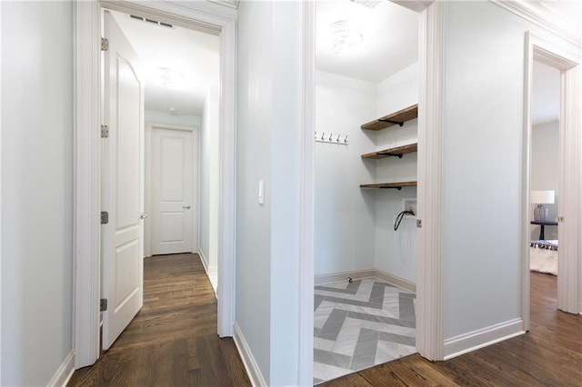 corridor featuring dark hardwood / wood-style flooring