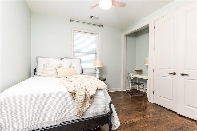 bedroom featuring ceiling fan and dark wood-type flooring