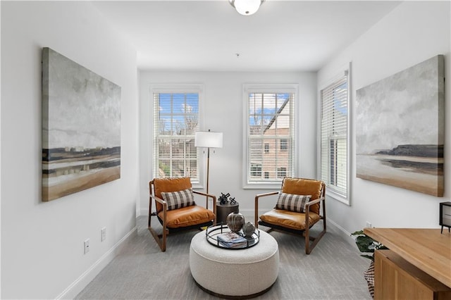 sitting room with light colored carpet