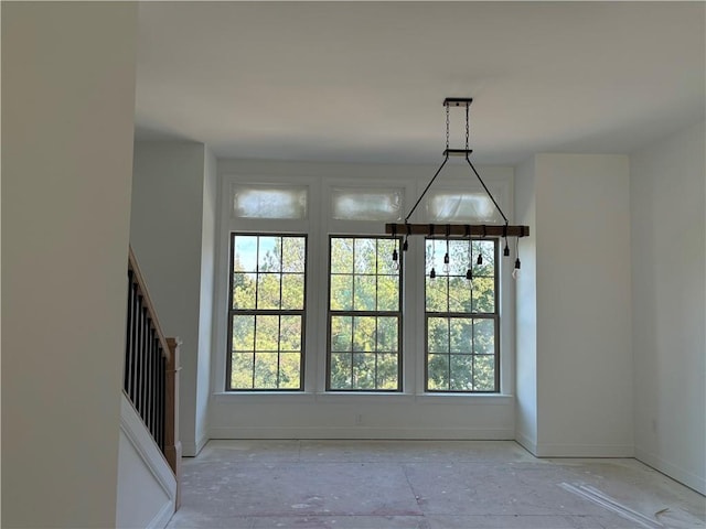 unfurnished dining area featuring a wealth of natural light