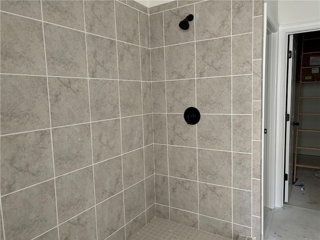 bathroom with a tile shower