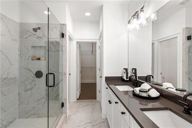 bathroom with vanity and an enclosed shower