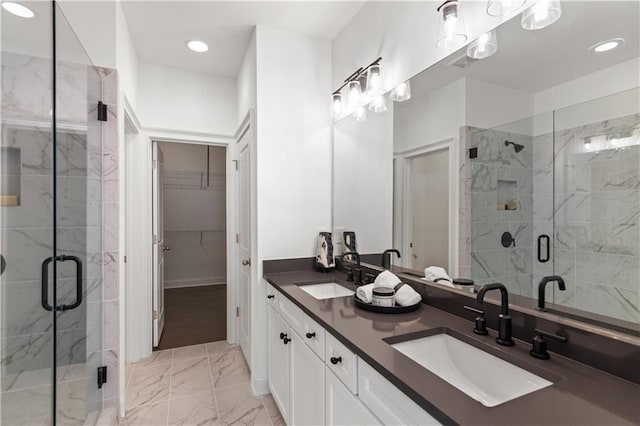 bathroom with vanity and an enclosed shower