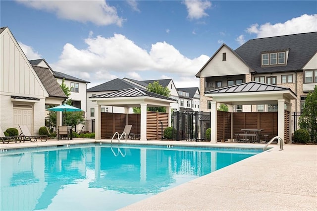 view of swimming pool with a gazebo and a patio