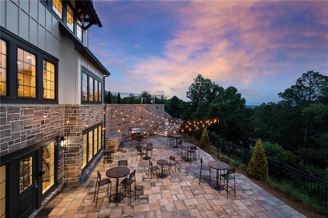 view of patio terrace at dusk