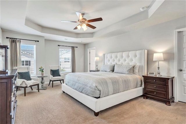 36 Mead Ct, Hoschton, GA 30548 - bedroom featuring light colored carpet, a tray ceiling, and a ceiling fan