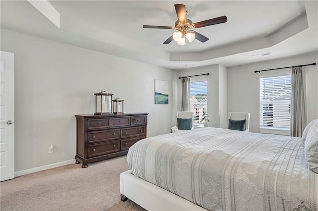 36 Mead Ct, Hoschton, GA 30548 - carpeted bedroom featuring a raised ceiling and a ceiling fan