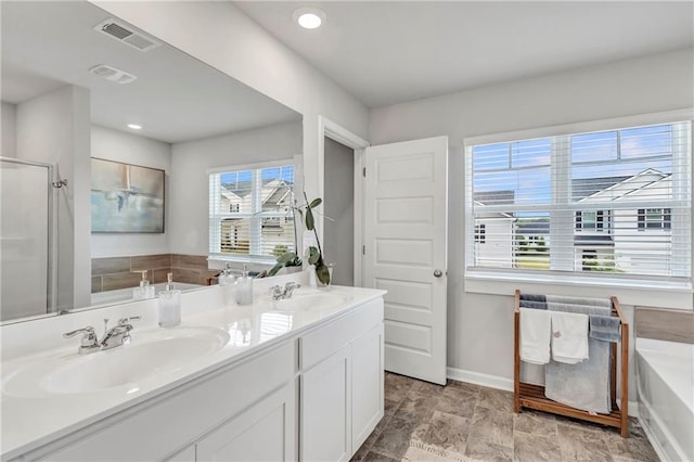 36 Mead Ct, Hoschton, GA 30548 - bathroom featuring double vanity, a bath, an enclosed shower, and recessed lighting