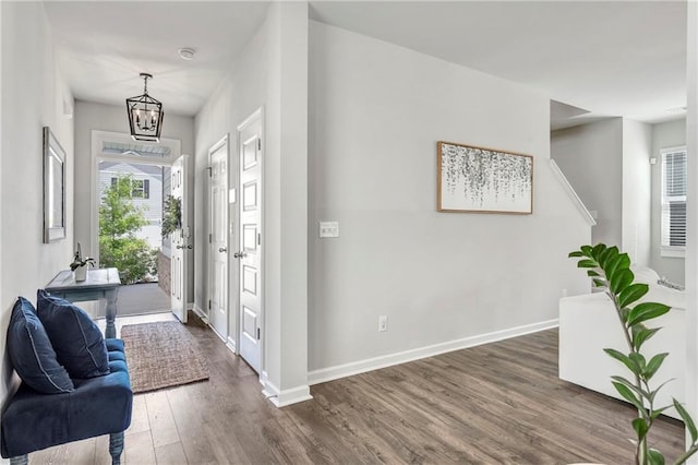 36 Mead Ct, Hoschton, GA 30548 - entrance foyer with dark wood finished floors and a chandelier