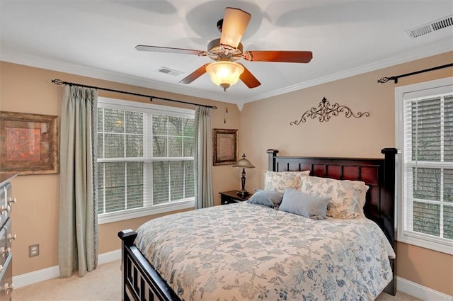 bedroom featuring light colored carpet, multiple windows, and visible vents