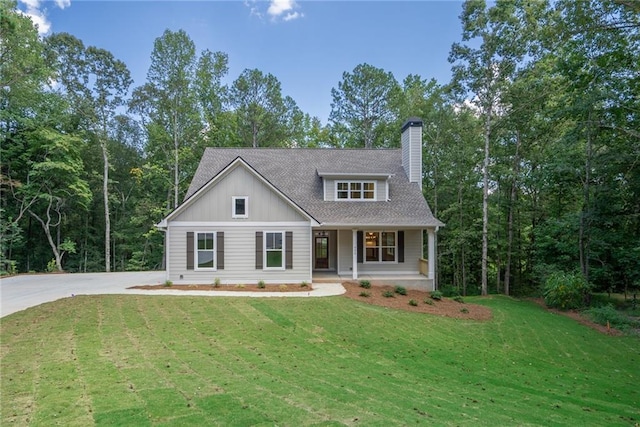 view of front of house featuring a front yard and a porch