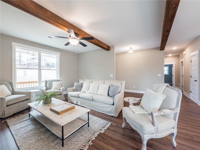 unfurnished living room with sink, beam ceiling, wood-type flooring, a brick fireplace, and ceiling fan with notable chandelier