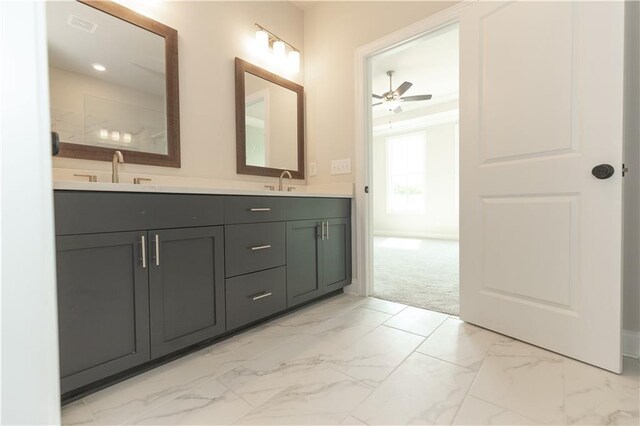 bathroom featuring tile patterned floors, double sink vanity, and ceiling fan