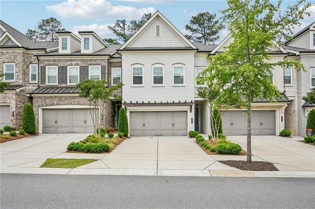 20056 Windalier Way, Roswell, GA 30076 - townhome / multi-family property with driveway, brick siding, a garage, and a standing seam roof
