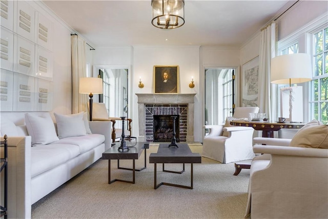 carpeted living area featuring a fireplace and crown molding