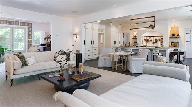 living area with recessed lighting and wood finished floors