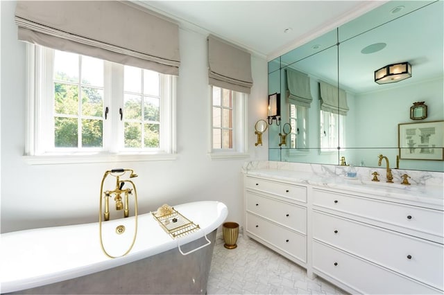 full bath with a soaking tub, vanity, and crown molding