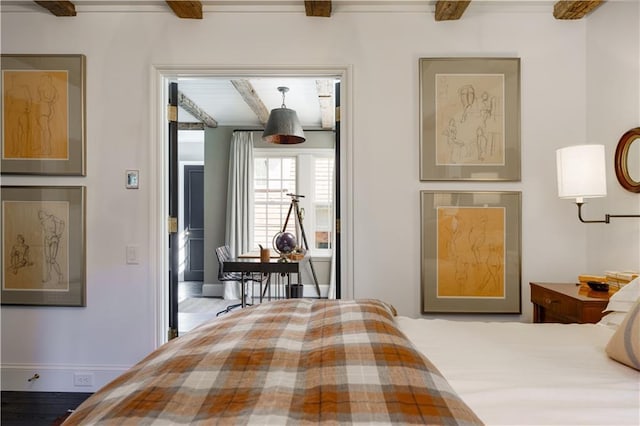 bedroom featuring beamed ceiling