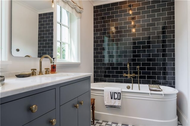 full bathroom with a bathing tub, vanity, and ornamental molding