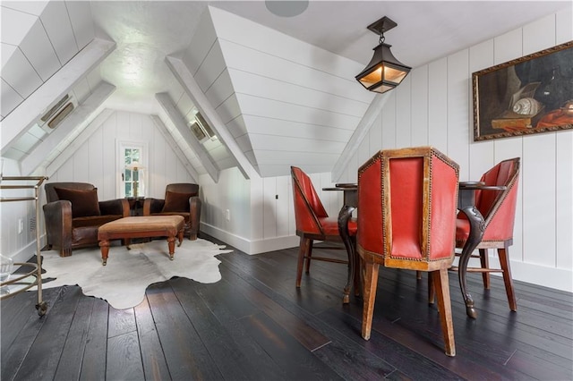 sitting room with hardwood / wood-style floors, lofted ceiling, and baseboards