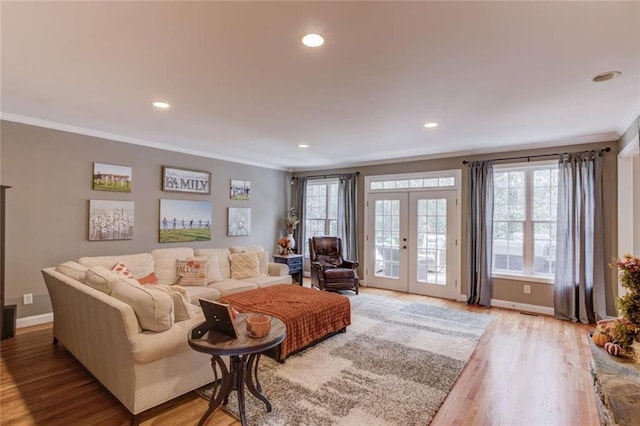 3000 The Springs Dr, Monroe, GA 30656 - living room with crown molding, light wood-style floors, recessed lighting, and french doors