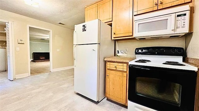 kitchen featuring baseboards, light wood-type flooring, light countertops, white appliances, and a textured ceiling