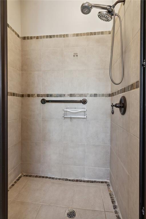 bathroom with a tile shower