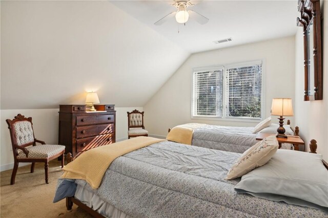 carpeted bedroom featuring ceiling fan and lofted ceiling