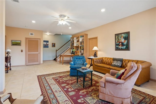 living room featuring ceiling fan and light tile patterned flooring