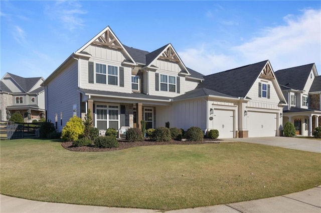 view of front facade with concrete driveway, fence, board and batten siding, and a front lawn