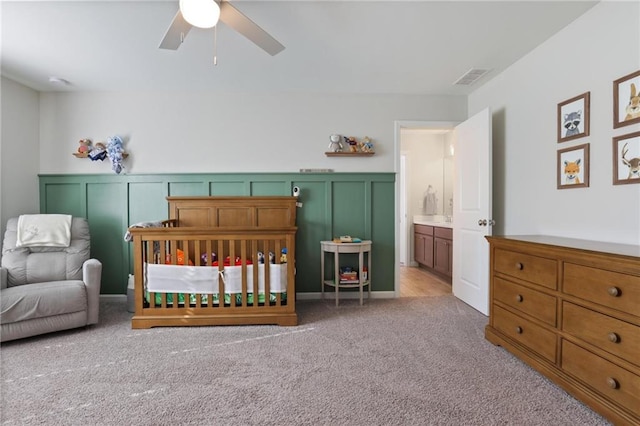 carpeted bedroom featuring visible vents and a ceiling fan