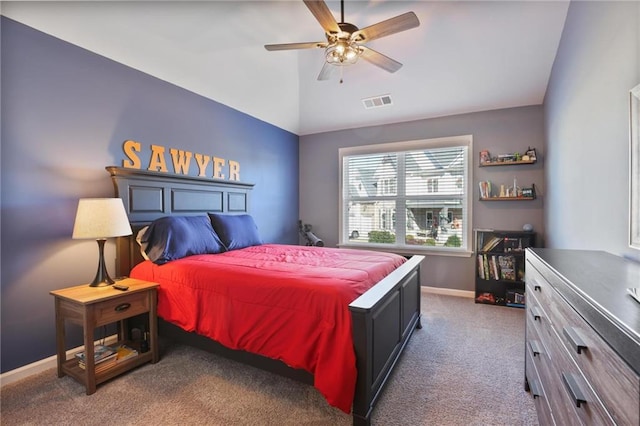 carpeted bedroom featuring vaulted ceiling, baseboards, visible vents, and ceiling fan