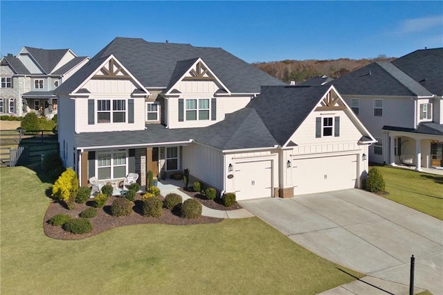 view of front of home with a front yard, a porch, concrete driveway, a garage, and board and batten siding