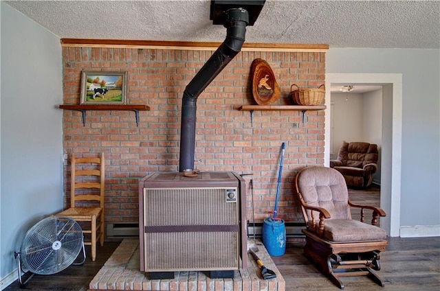 details with a wood stove, a textured ceiling, and wood finished floors