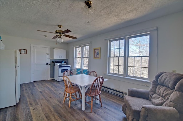 dining room with dark wood-style floors, a textured ceiling, baseboard heating, and a ceiling fan