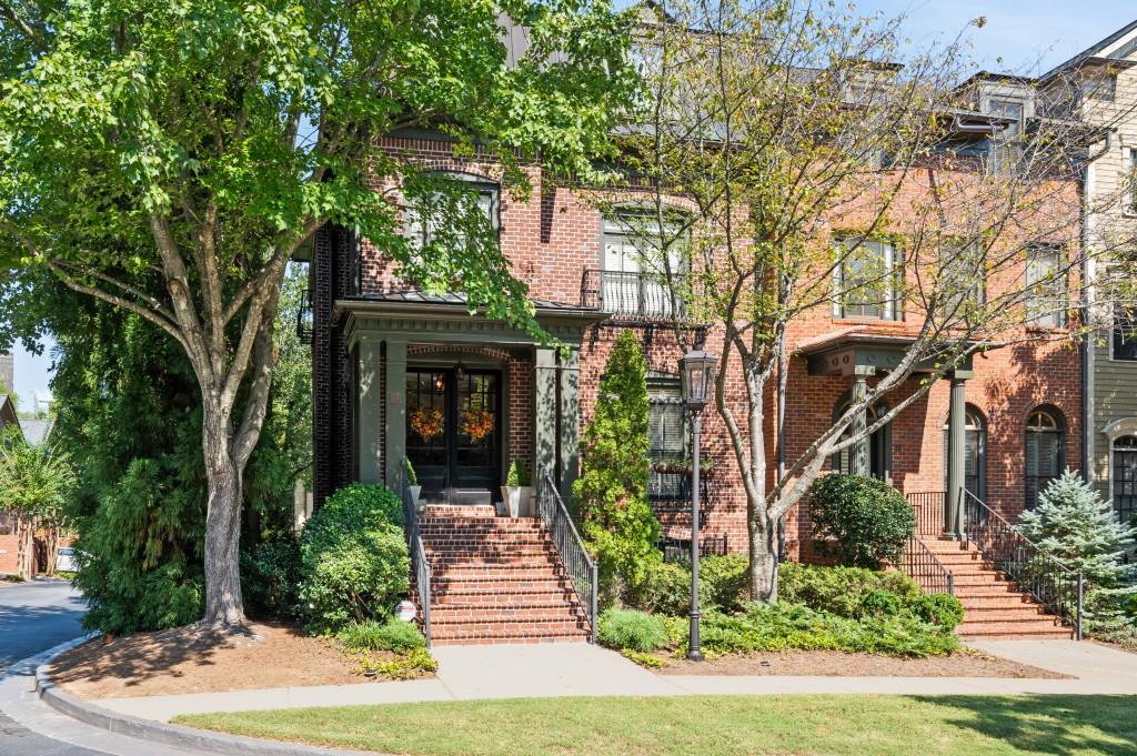 3127 Lenox Rd NE Unit 20, Atlanta, GA 30324 - view of front of house with brick siding, french doors, and stairway