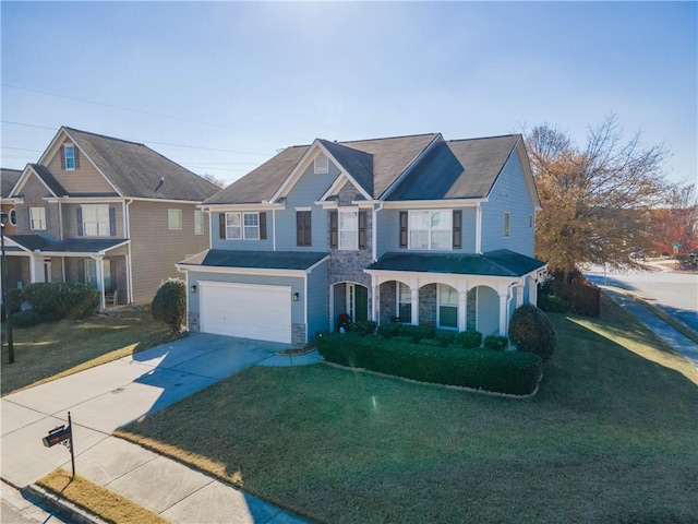 view of front of house with covered porch, a garage, and a front lawn