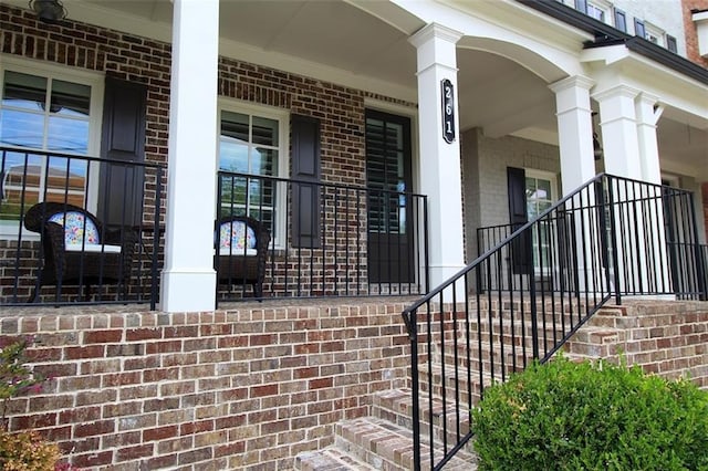 property entrance featuring covered porch