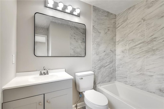 full bathroom featuring a textured ceiling, vanity, toilet, and tiled shower / bath