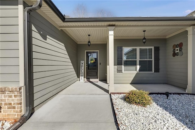 doorway to property with a porch