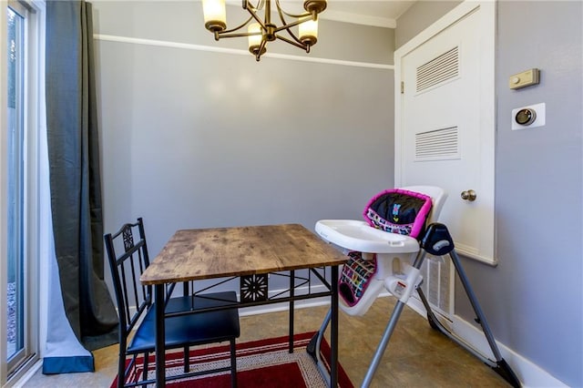 dining space with tile patterned floors, baseboards, and an inviting chandelier