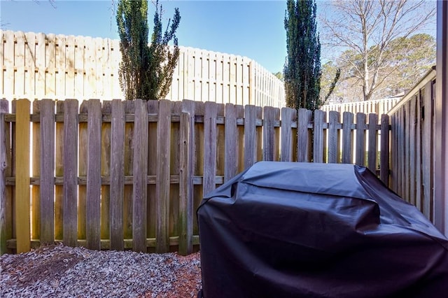 view of patio with fence and area for grilling