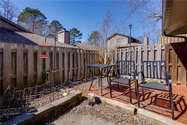 exterior space with a fenced backyard