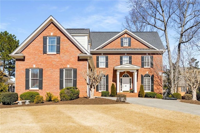 view of front facade featuring brick siding