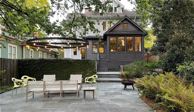 back of house with a patio area, fence, and a pergola