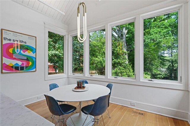 sunroom featuring a healthy amount of sunlight and visible vents